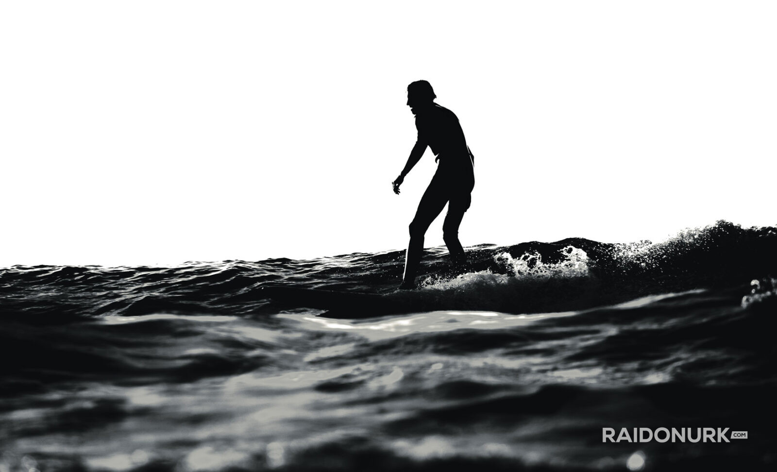 Black and white fine art photographs of surfers in action and at rest, silhouetted against bright skies and dramatic waves, capturing the essence of surfing in a minimalist, high-contrast visual style.